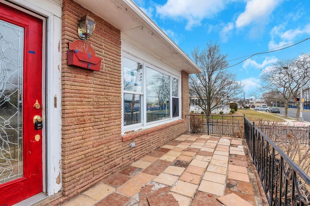 view of patio featuring fence