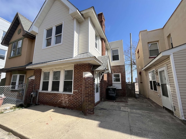 11 Belle Haven Ct, Atlantic City, NJ 08401 - multi unit property featuring a patio, fence, brick siding, and a chimney