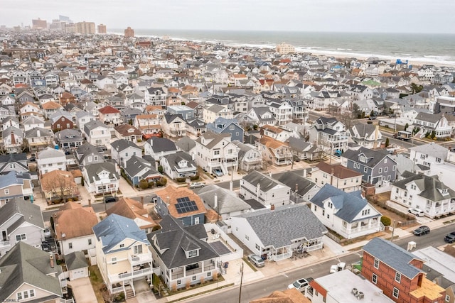 birds eye view of property with a residential view and a water view