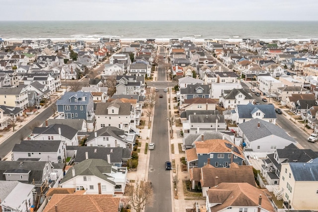 drone / aerial view featuring a residential view and a water view