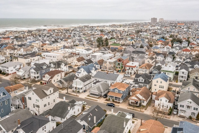 bird's eye view with a residential view and a water view