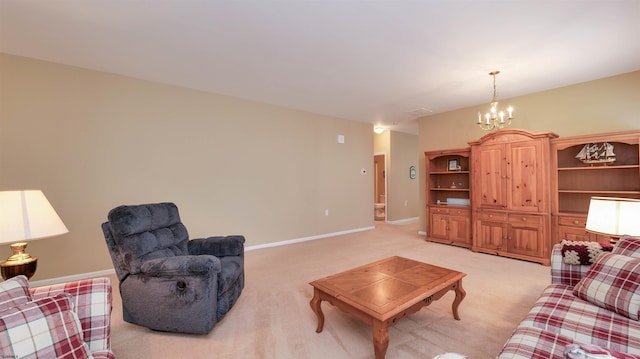 living room featuring light colored carpet, baseboards, and an inviting chandelier