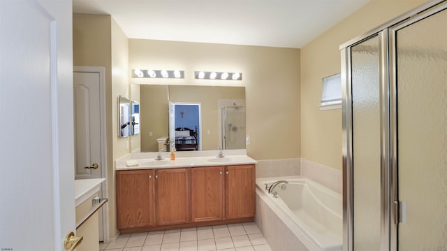 full bath featuring double vanity, a bath, a stall shower, and a sink