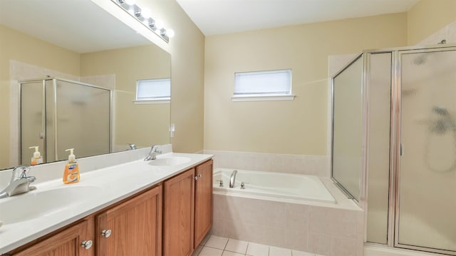 bathroom with a bath, a wealth of natural light, and a sink