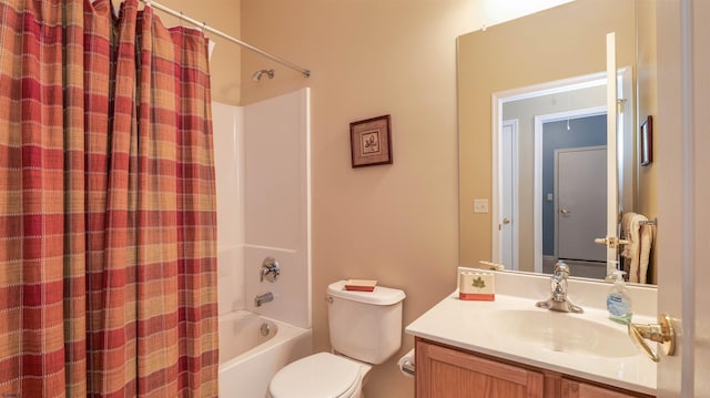 bathroom featuring vanity, shower / tub combo, and toilet