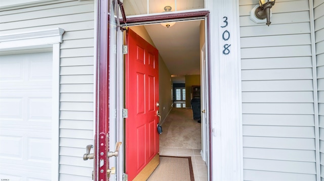 entrance to property featuring a garage