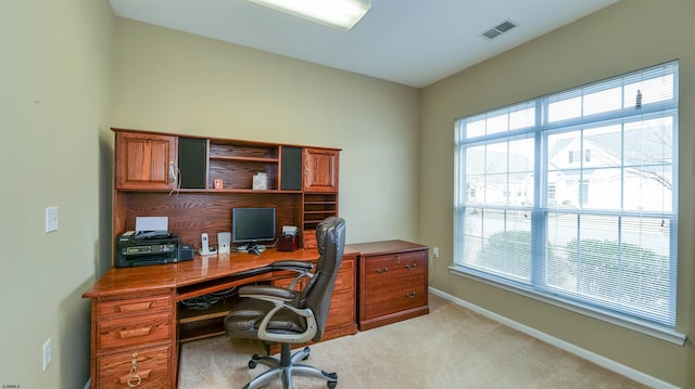 office area with light carpet, visible vents, and baseboards