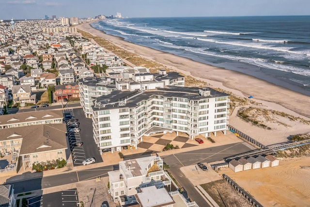 birds eye view of property featuring a view of the beach and a water view