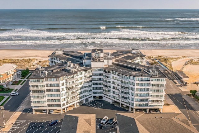 bird's eye view with a water view and a view of the beach