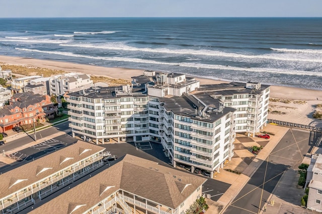 aerial view featuring a water view and a beach view