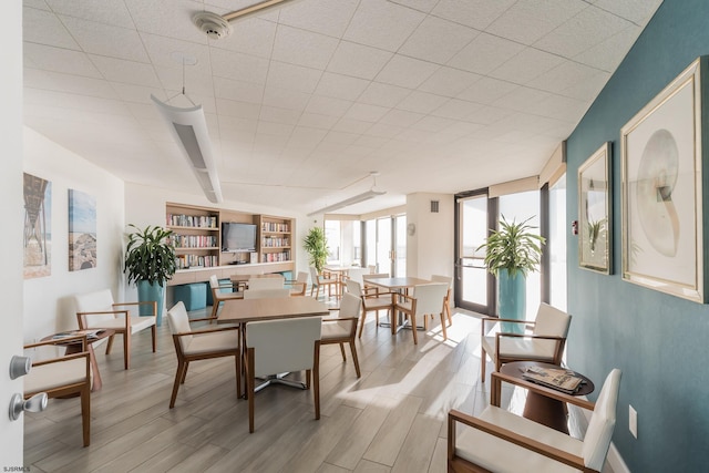 dining area with wood finish floors