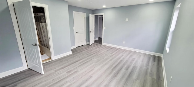 unfurnished bedroom featuring recessed lighting, baseboards, and wood finished floors