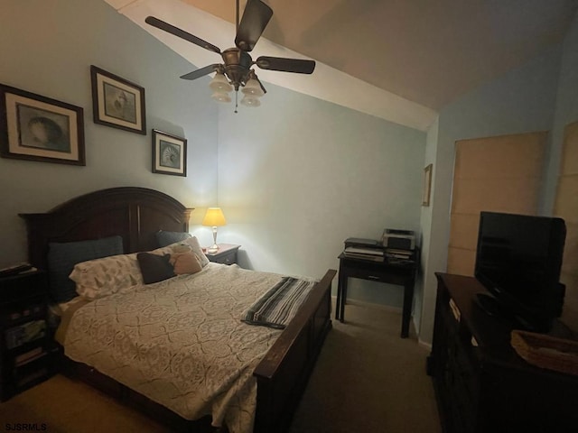 carpeted bedroom featuring baseboards, lofted ceiling, and ceiling fan