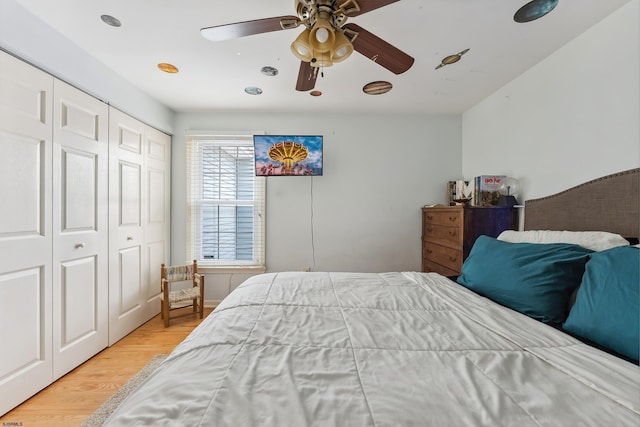 bedroom featuring a closet, a ceiling fan, and wood finished floors