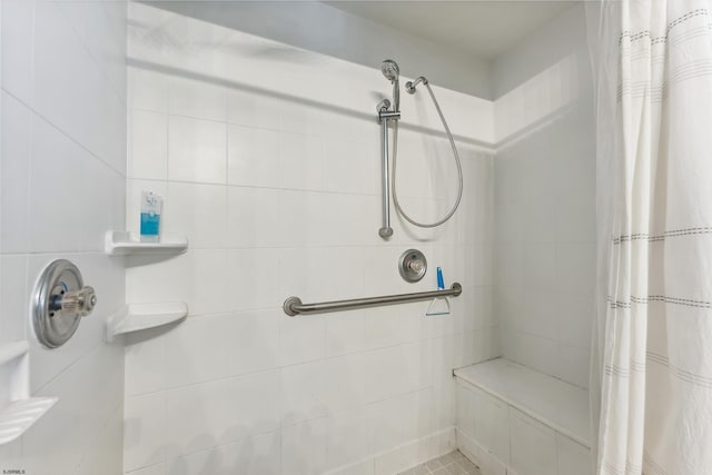 full bathroom with tiled shower