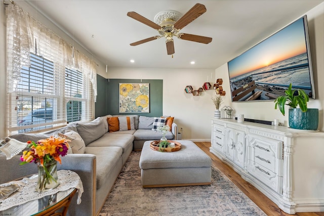 living room with recessed lighting, baseboards, light wood finished floors, and ceiling fan