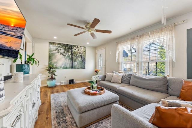 living room with visible vents, a ceiling fan, recessed lighting, light wood finished floors, and baseboards