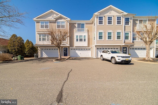 view of front of property with driveway and an attached garage