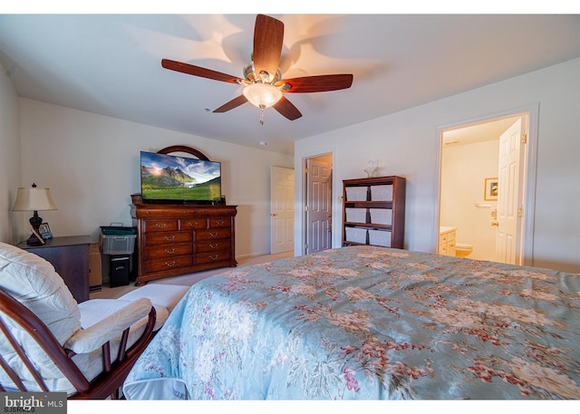 bedroom featuring ensuite bathroom and ceiling fan