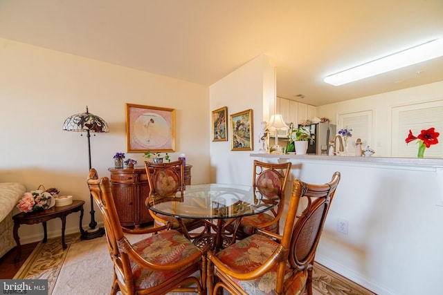 dining room featuring baseboards