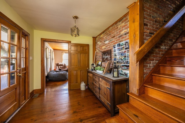 hall with stairs, dark wood-type flooring, and baseboards