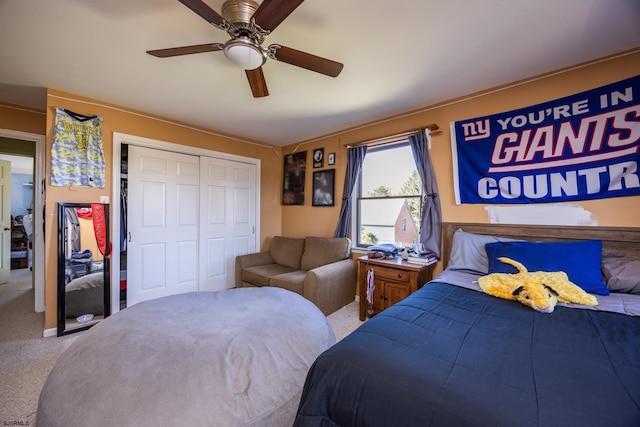 bedroom with a closet, carpet floors, and ceiling fan