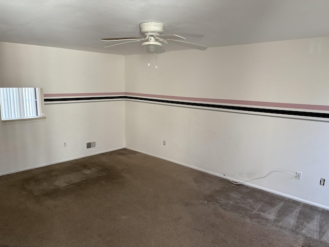 carpeted empty room with visible vents and ceiling fan