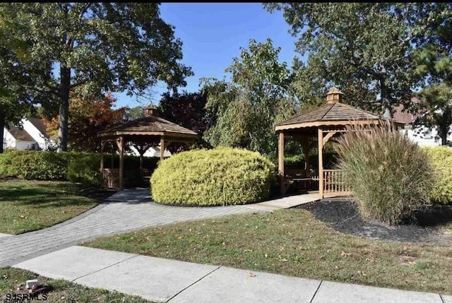 view of community with a gazebo and a lawn