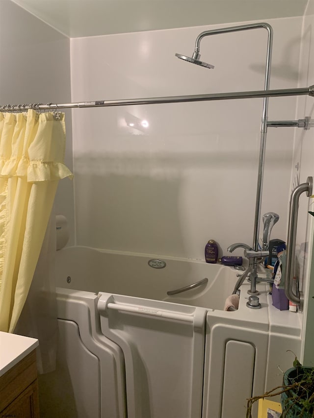 bathroom featuring vanity and shower / tub combo