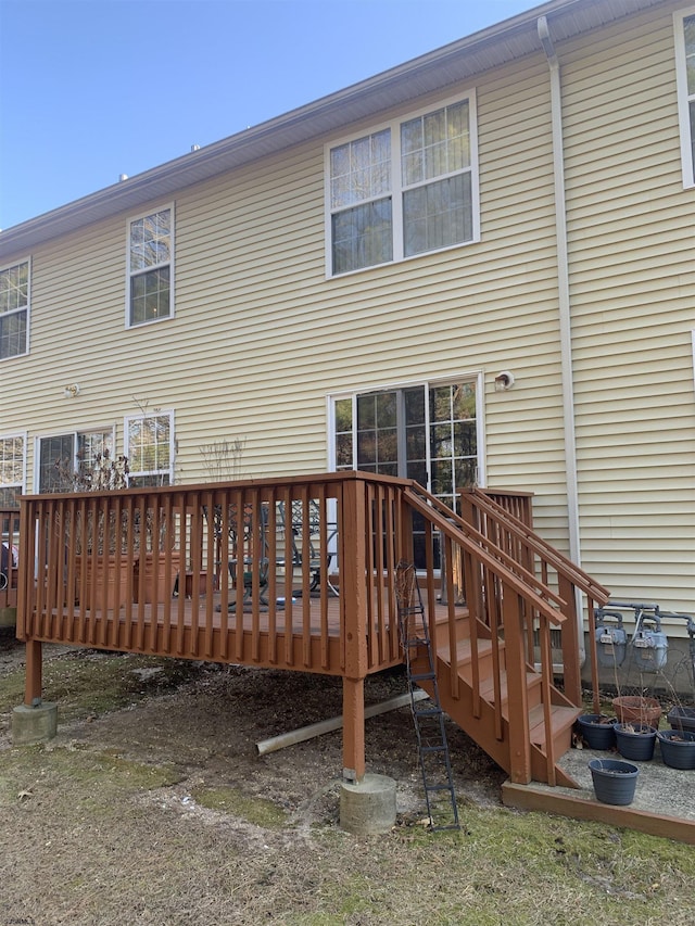 rear view of property featuring a deck