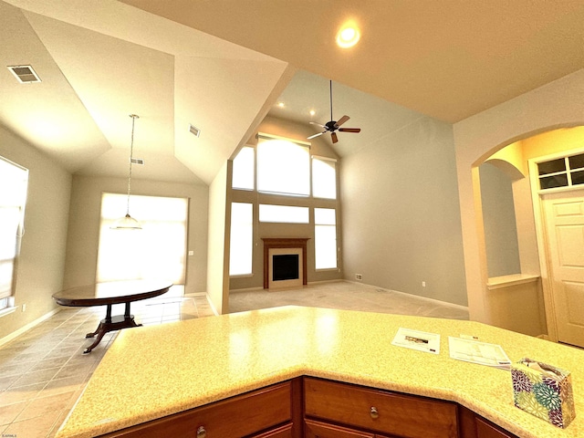 kitchen featuring recessed lighting, arched walkways, visible vents, and ceiling fan