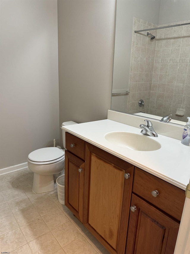 bathroom featuring a shower, toilet, vanity, and tile patterned flooring