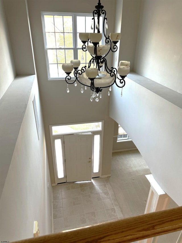 entryway with an inviting chandelier