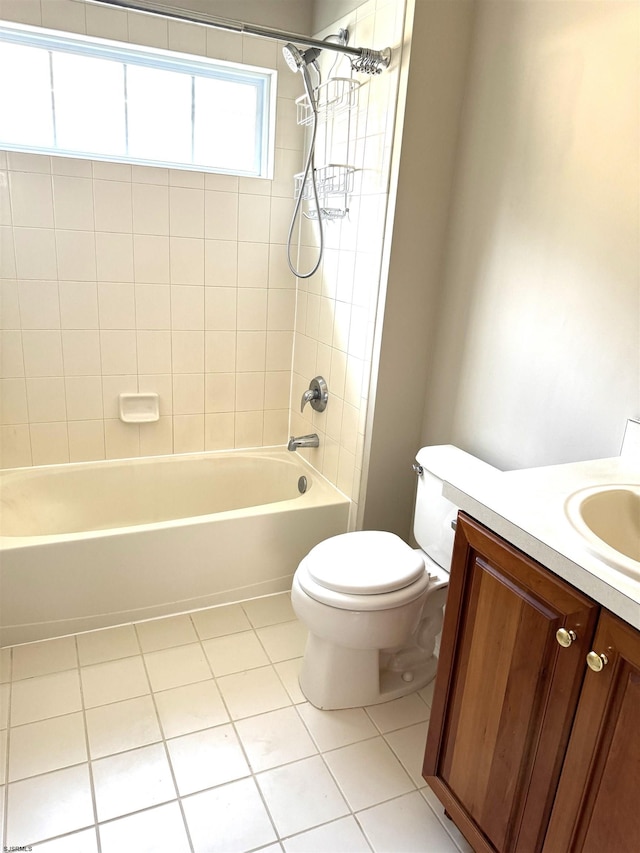 bathroom featuring tub / shower combination, toilet, vanity, and tile patterned flooring