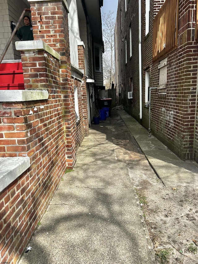 view of property exterior featuring brick siding