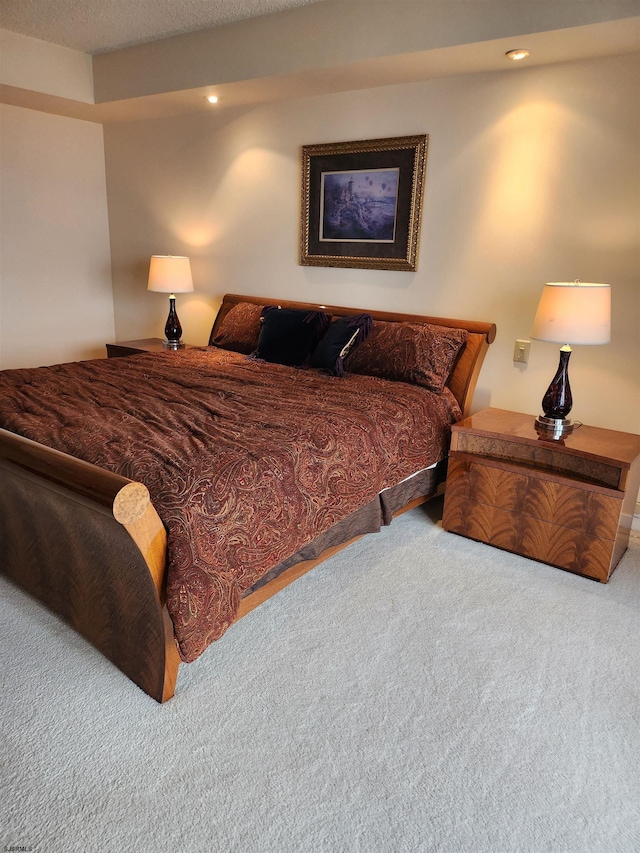 bedroom with recessed lighting and carpet flooring