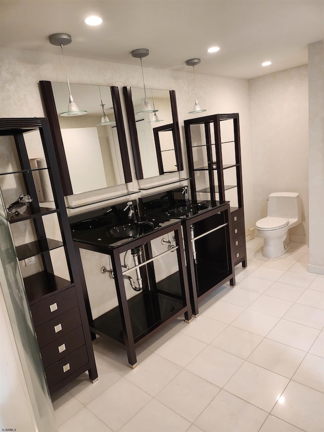 bathroom featuring recessed lighting, toilet, vanity, and tile patterned floors