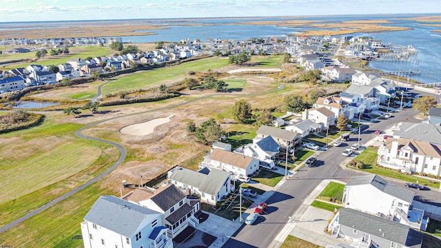 birds eye view of property featuring a residential view, a water view, and golf course view