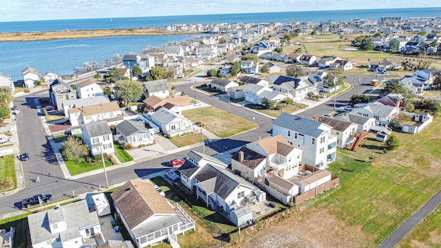 aerial view featuring a residential view and a water view