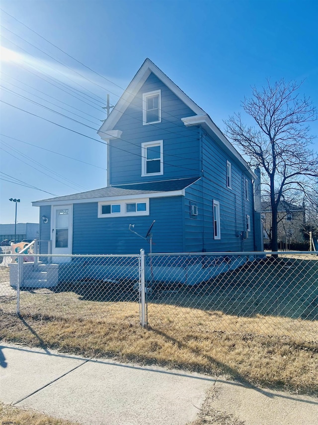 view of front of house featuring fence