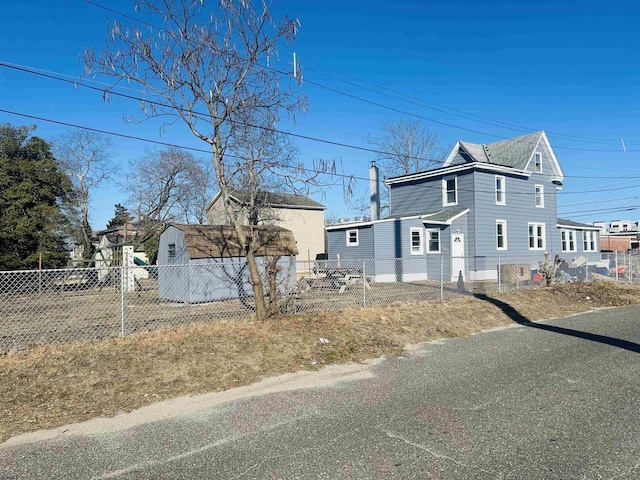 view of side of home with fence