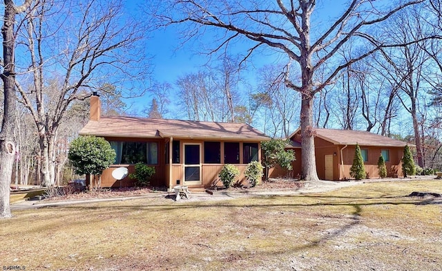 single story home with a chimney