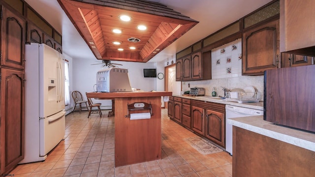 102 Morris Ave, Linwood, NJ 08221 - kitchen featuring white appliances, a ceiling fan, visible vents, a tray ceiling, and backsplash
