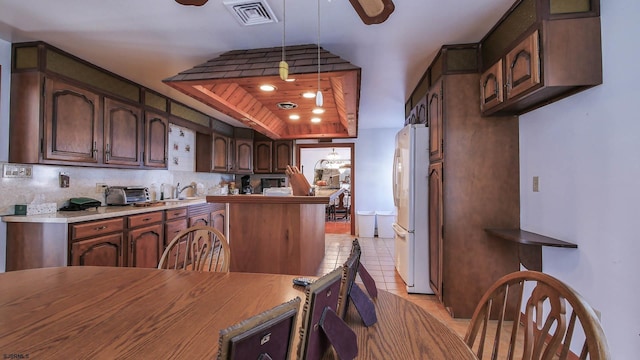 102 Morris Ave, Linwood, NJ 08221 - kitchen with visible vents, backsplash, freestanding refrigerator, light tile patterned floors, and ceiling fan