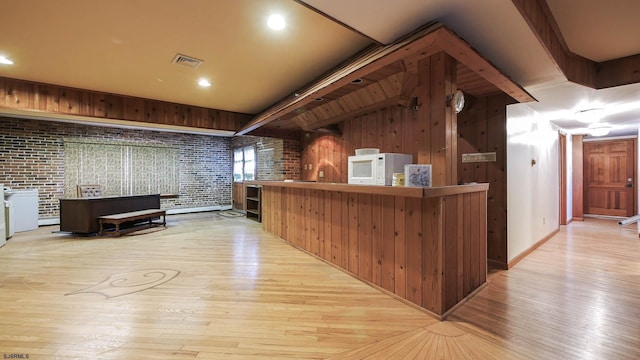 102 Morris Ave, Linwood, NJ 08221 - bar with white microwave, visible vents, brick wall, beam ceiling, and wood finished floors