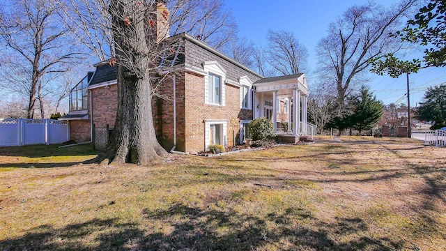 102 Morris Ave, Linwood, NJ 08221 - view of property exterior with a yard, fence, and brick siding