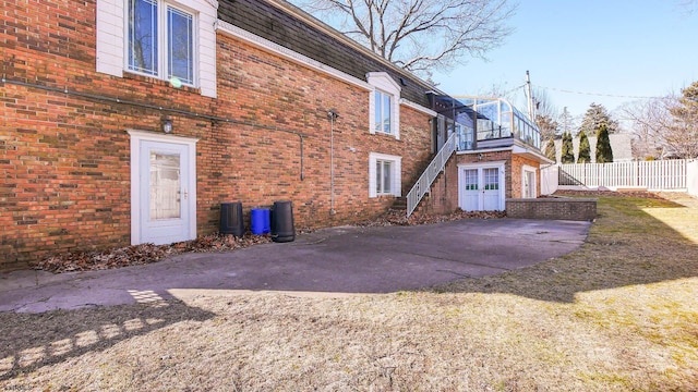 102 Morris Ave, Linwood, NJ 08221 - view of side of home featuring brick siding, stairs, and fence