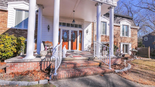 102 Morris Ave, Linwood, NJ 08221 - doorway to property featuring french doors, brick siding, and covered porch