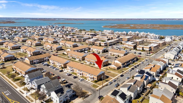 drone / aerial view with a water view