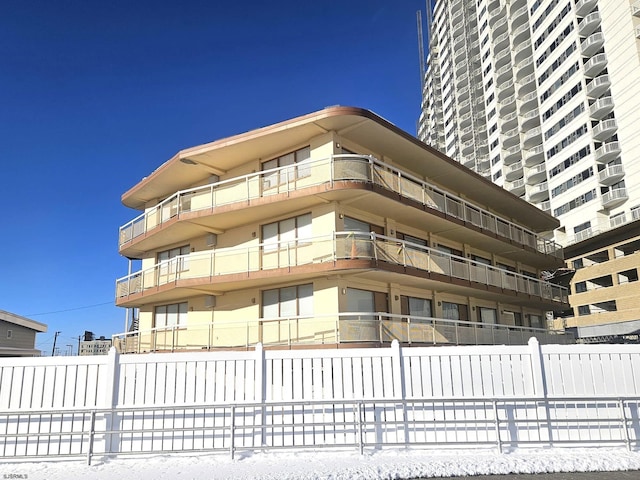view of property with fence